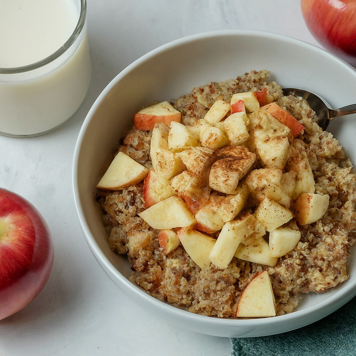 Quinoa breakfast bowl with apples and walnuts